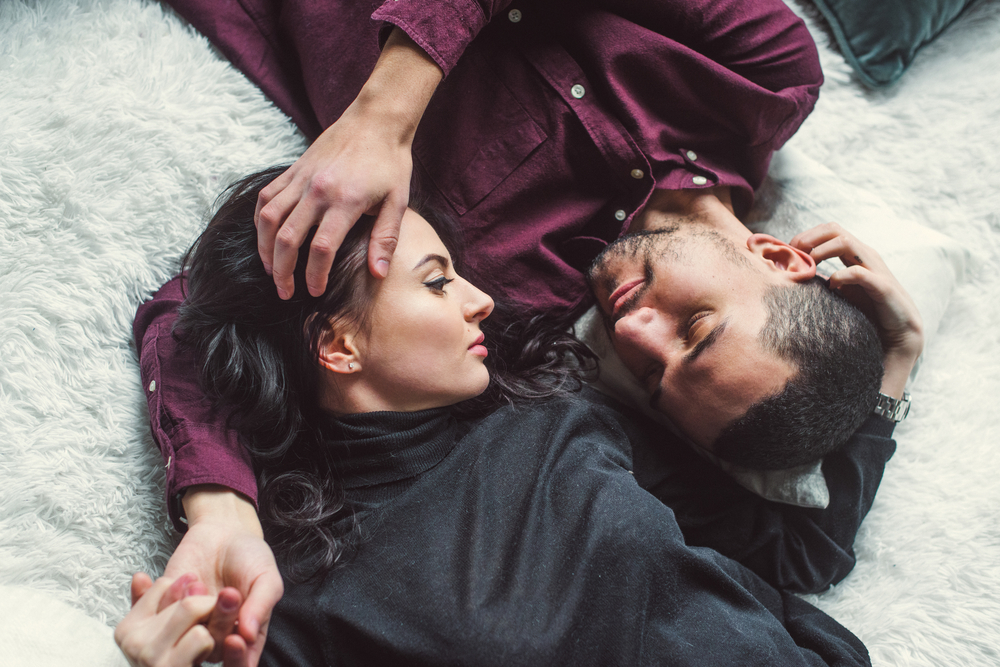 Man and woman embracing in bed - Sagittarius Man In Love